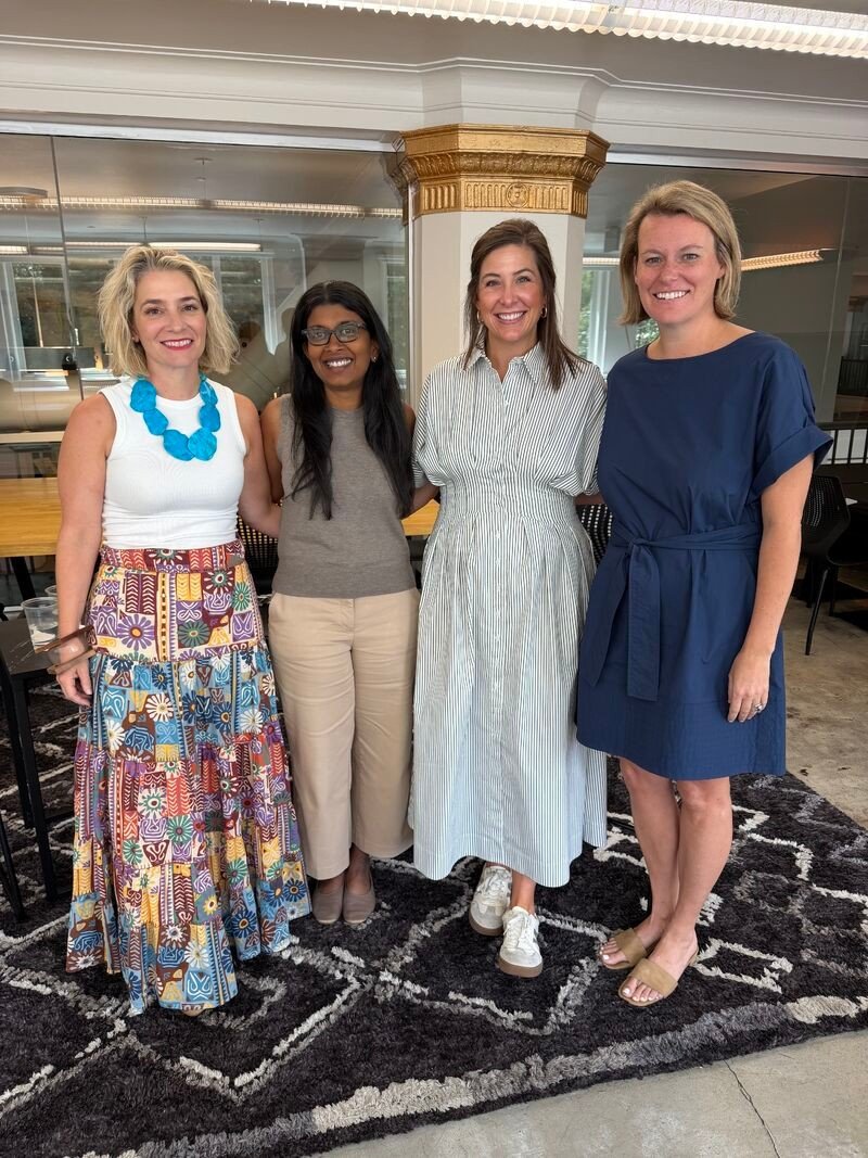 Four women smiling together at the Forge Summer Series